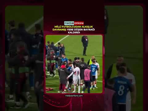 Milli Futbolcudan Alkışlık Davranış: Yere Düşen Bayrağı Kaldırdı