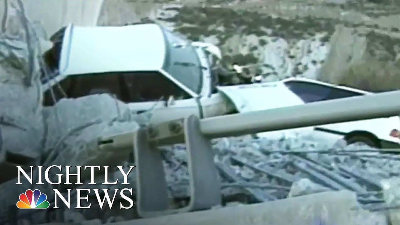 Car accident near cliff edge aftermath.