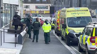 Man led out of asylum seeker hotel in Newquay, Cornwall by emergency service worker in hazmat suit