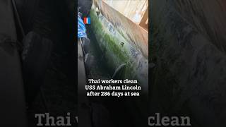 Thai workers clean USS Abraham Lincoln after 286 days at sea