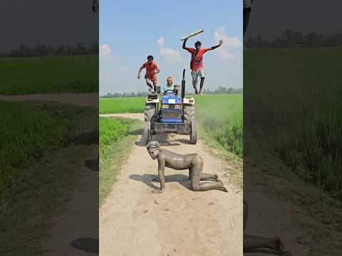 Statue in front of a tractor in the middle of the road.