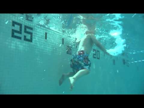William retrieving his dive sticks from the bottom of the pool