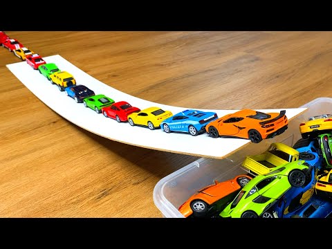 Various Bigger and Smaller Diecast Model Cars Moving Down On Slider.  Slope driving test #13