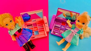 Elsa and Anna toddlers play with make up