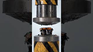 A hyper-realistic close-up of a powerful hydraulic press crushing an object.The object is a [battery