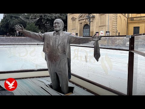 YouTube video thumbnail: Pavarotti’s Widow Furious After Italian Town Builds ice Rink Around Statue of Opera Legend