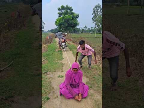 The woman sits in the middle of the road.99