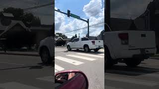 Ride with me through Pigeon Forge Tennessee flags are down Dolly signs everywhere 🦋🕊️🧡🤍🧡