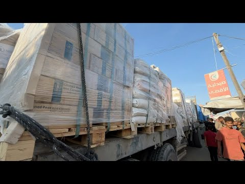 Trucks carrying WFP aid pass by Gaza's Khan Yunis | AFP