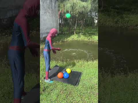 popping water balloon into rain water