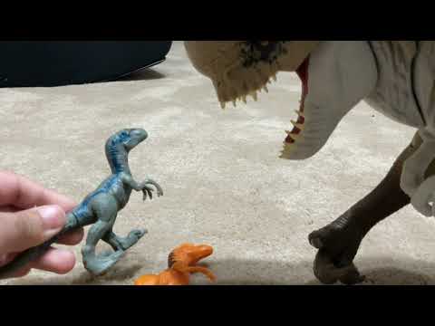 Two velociraptors  are bullying D-Rex￼