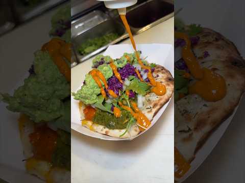 HALF CHICKEN TIKKA HALF SAAG PANEER GARLIC CHEESE NAAN TACO from TACO MAHAL in NYC!! 🔥 #DEVOURPOWER