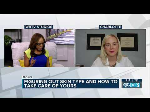 Professional woman smiling on city street.