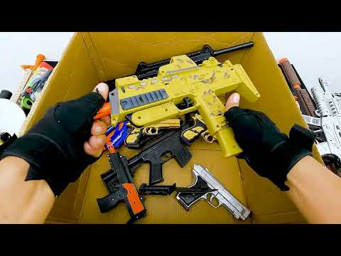 What's Inside This Insane Toy Gun Box! AK-47, Gold Pistols, RPG Rifle, Grenades, Scopes & More!
