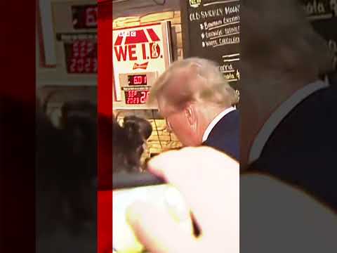 Donald Trump signed a woman's top and gave out pizza as he visited a pub. #Shorts #Iowa #DonaldTrump