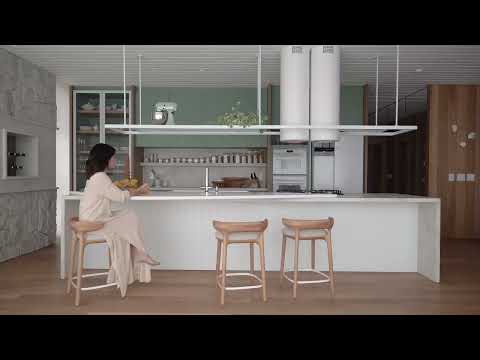 Dekton Nilium unfolds its warm beauty throughout the range of organic materials of this sensory home