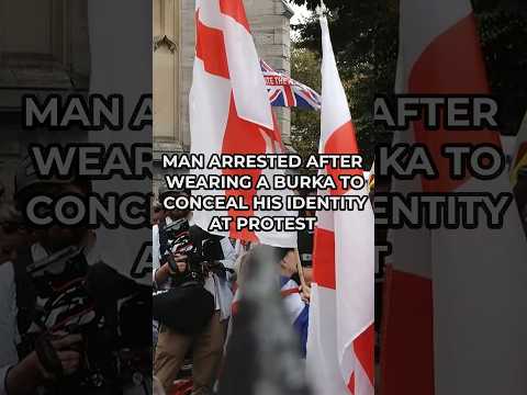 A man has been ARRESTED at a protest after covering his face with a burka