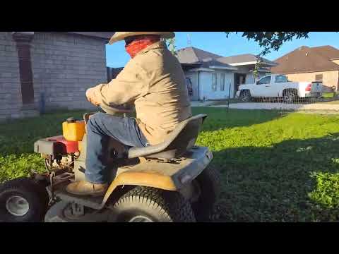My dad's cutting the grass
