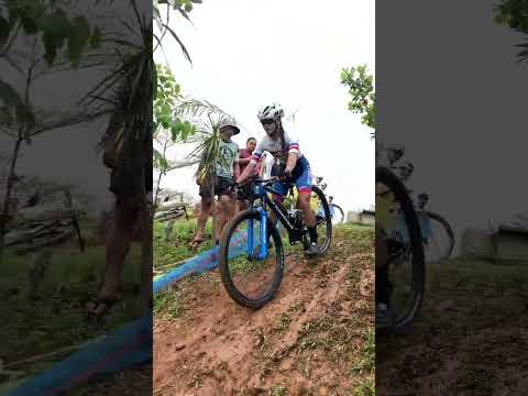 Mountain Biker Wipes Out on Muddy Slope During Race