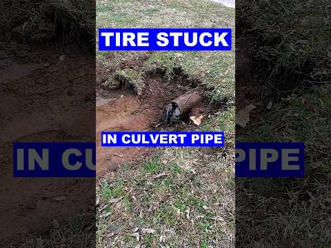 Tire Stuck Cleaning Culvert