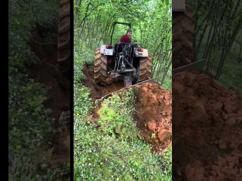 TRACTOR STRAIGHTENS THE MOUNTAIN