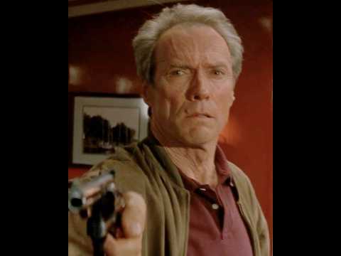 It's very detailed—he uses his hand to gauge the weight of the gun.