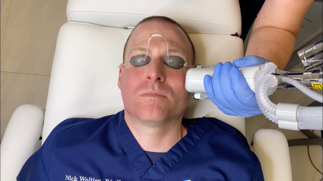 Patient receiving a facial treatment in clinic.