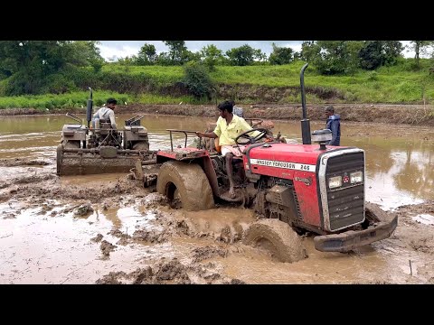 Massey ferguson 4wd tractor stuck in mud pulling out by Eicher and Massey ferguson tractors