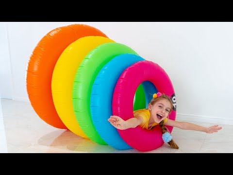 Alicia is having fun with giant stacking rings | Put Your Hands in the Air Song