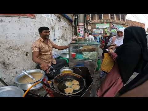 Bangladesh, pitha shops are like a festival fair in the busy city in the morning and evening |