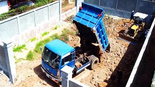 Awesoem Show Dump Trucks Unloading Stones Operation With Fast Dozer Pushing Skills In Land Fill