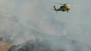 Live helicopter aerials tracking the spread of a large-scale fire in Simi Valley, California
