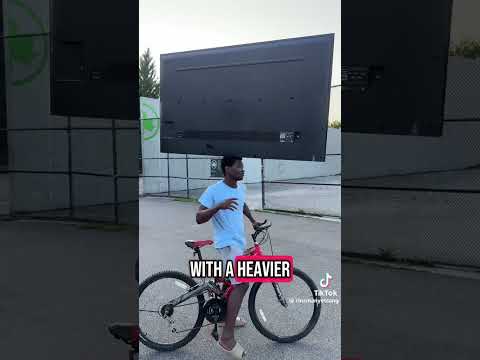 This man brought his 72" TV home ON HIS HEAD riding a bike 🚲 📺