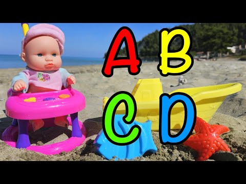 Baby doll playing with ABC Song for kids