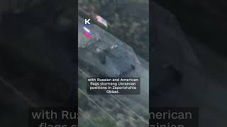 Russian media shows US armored vehicle with Russian, American flags storming Ukrainian positions
