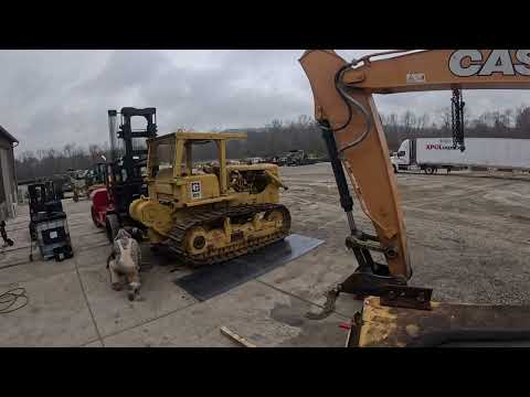 Time lapse of prepping a Cat D7F dozer for overseas shipment in a container