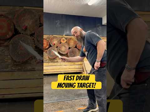 World champion knife thrower throwing fast draw at moving target!