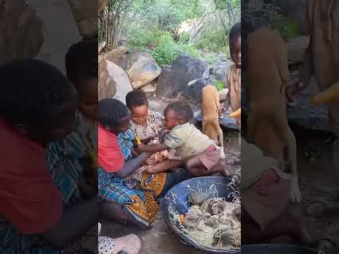 The four grandmother and grandchildren were arguing over the chicken while eating.