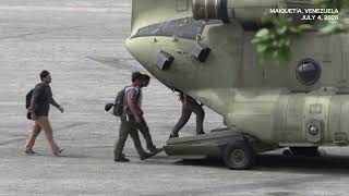 SCENES US military helicopters load up and take off in quake struck Venezuela