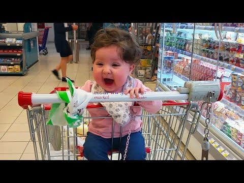 Cute Baby Sitting For The First Time In a Shopping Cart - Hilarious Reaction