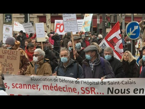 French protesters march to defend public health service | AFP