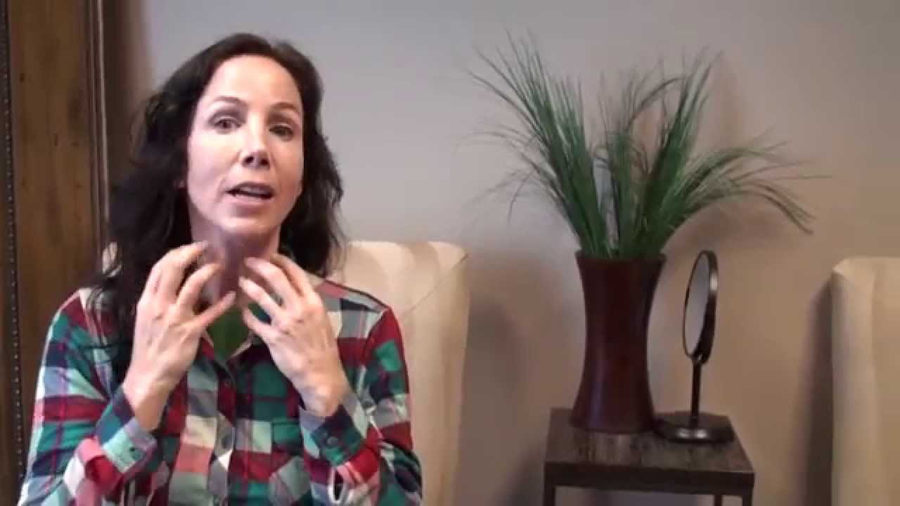 Woman discussing skincare in a cozy setting.