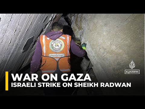 Rescue workers search for survivors after an Israeli attack on Gaza City’s Sheikh Radwan