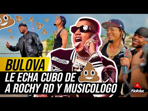 BULOVA LE ECHA CUBO DE "PUSPU" A MUSICOLOGO & ROCHY RD (REFLEXION)