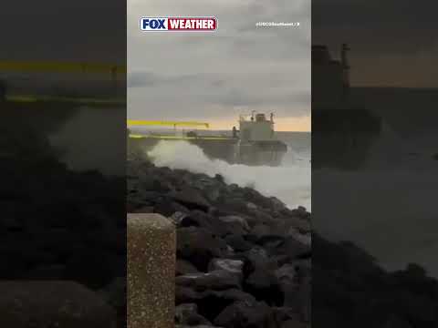 Strong Waves Pound Grounded Barge Off San Juan Harbor