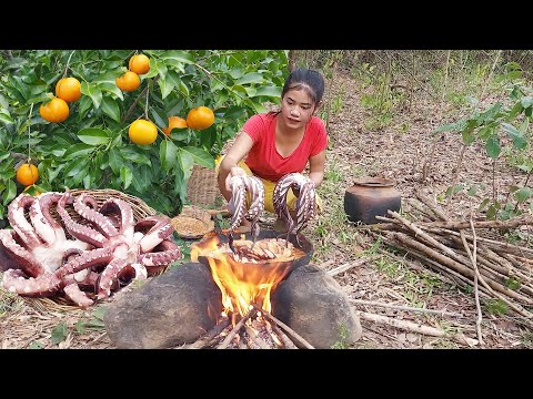 Cooking Octopus arm and Pick wild oranges for food in forest, Survival cooking