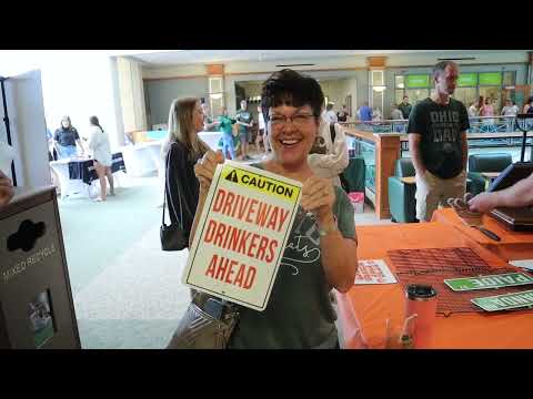 Students & Parents create road signs at student magazine meatball mixer