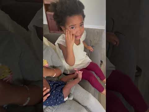 The kids are fighting over the baby!