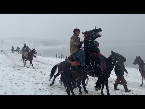 People enjoy first snow outside Afghan capital | AFP