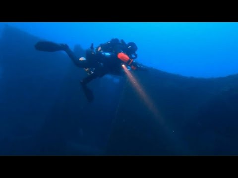 Divers retrieve objects from wreckage of Titanic sister ship in Greece | AFP
